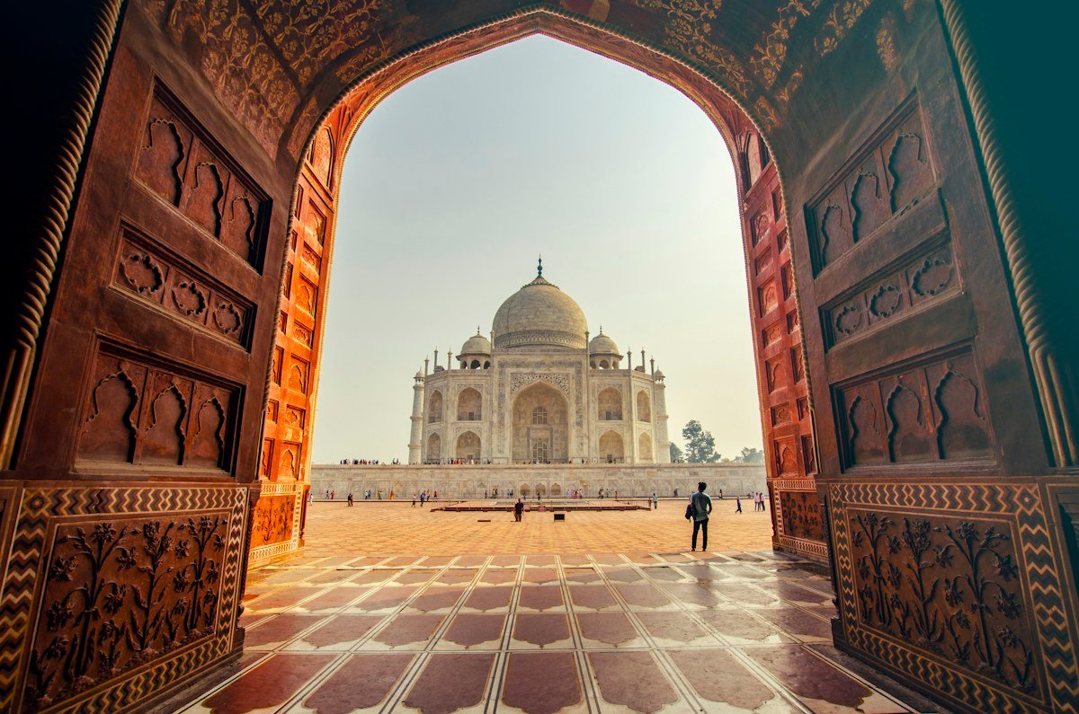 Taj Mahal viewed through a historic gateway